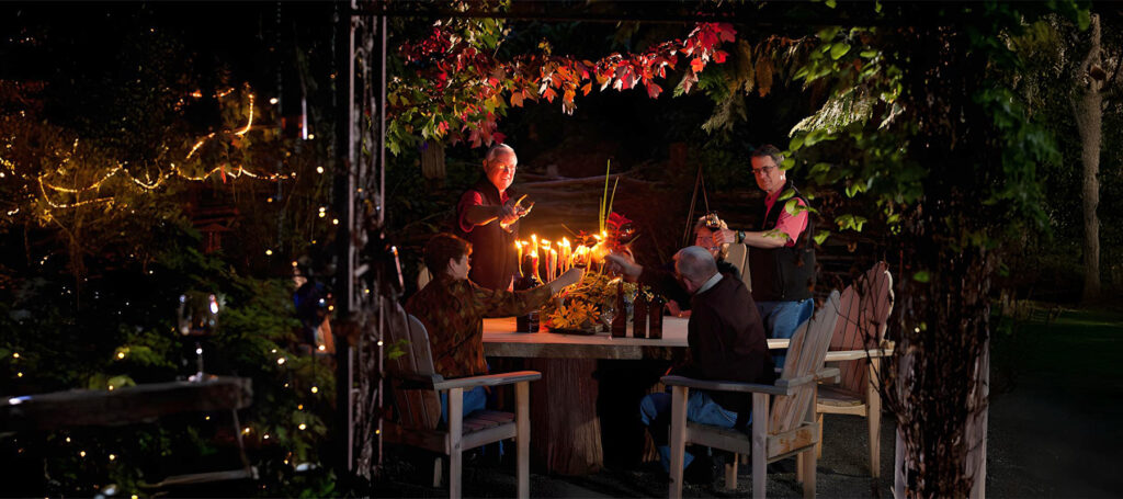 evening party in garden cheersing wine