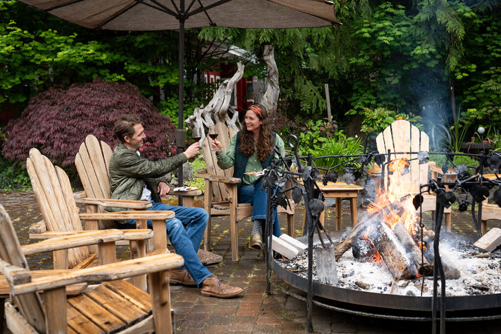 couple by fire at winery